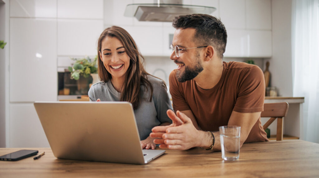 Couple working together on their laptop